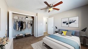 Denver apartment for rent - A bedroom with a bed, a dresser, a wardrobe, and a ceiling fan.