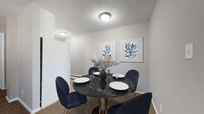 Denver apartment for rent - A dining room with a table set for two.