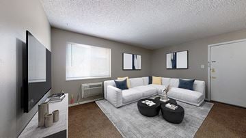 Denver apartment for rent - A living room with a white couch and a television.