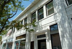 Denver apartment for rent - A white building with a sign that says "Imperial Palace Apartments".