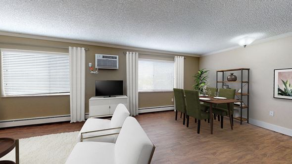 Englewood apartment for rent - A living room with a white couch and a television.