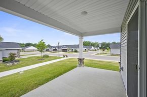 Strongsville apartment for rent - A white covered walkway leads to a house.