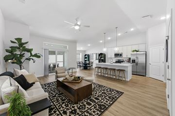 Amherst apartment for rent - A modern living room with a white sofa and a coffee table.