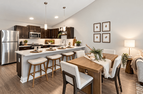 Strongsville apartment for rent - A modern kitchen with a dining table and chairs.