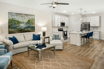 Pensacola apartment for rent - A living room with a white couch and a coffee table.