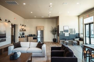 Salem apartment for rent - A modern living room with a white sofa and a wooden coffee table.