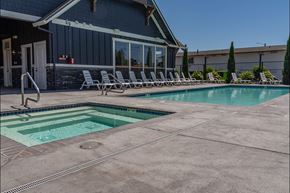 St Helens apartment for rent - A pool with a slide and lounge chairs outside a house at St Helens Place Apartment Homes, St Helens, 97051