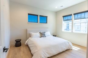 Pendleton apartment for rent - A bedroom with a large bed and two windows at Westgate Apartment Homes, Pendleton, 97801