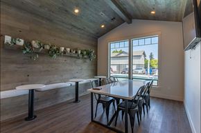 Sandy apartment for rent - A dining area with a long table and chairs at Sandyplace Apartment Homes, Sandy, Oregon