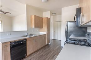 Silverton apartment for rent - A kitchen with a black dishwasher and stove top oven at Silverplace Apartment Homes, Silverton, 97381