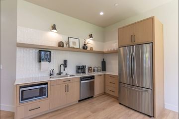 Molalla apartment for rent - A kitchen with wooden cabinets and stainless steel appliances.