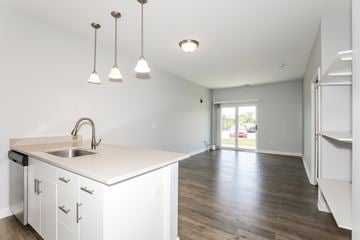 West Lafayette apartment for rent - A kitchen with white cabinets and a sink.