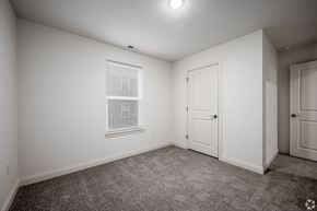 Lafayette apartment for rent - Bedroom with a carpeted floor, a window with blinds, and walk-in closet