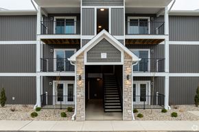 Lafayette apartment for rent - A modern three-story apartment building with balconies.