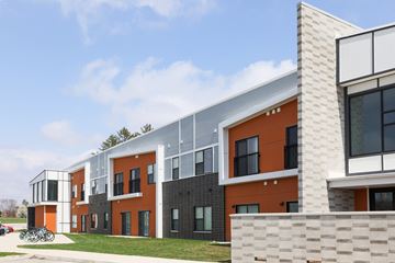 West Lafayette apartment for rent - A modern building with orange and grey exterior.
