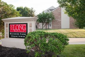 West Lafayette apartment for rent - A sign for Long Blackbird Farms is in front of a building.