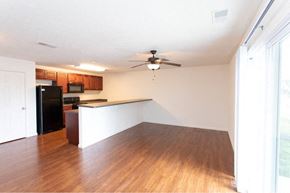 West Lafayette apartment for rent - A kitchen with a refrigerator, microwave, and oven.
