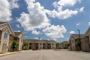 West Lafayette apartment for rent - A row of houses with a clear blue sky above them.