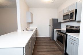 West Lafayette apartment for rent - A kitchen with white countertops and stainless steel appliances.