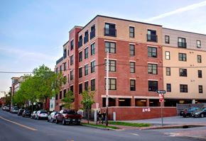 Portland apartment for rent - A red brick building with a stop sign in front of it.