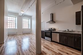 Lewiston apartment for rent - A kitchen with wooden floors and a stainless steel oven.