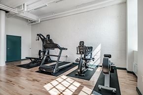 Lewiston apartment for rent - A gym with a treadmill and a stationary bike.