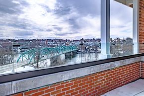 Lewiston apartment for rent - A view from a window of a bridge over a river.
