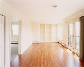 Portland apartment for rent - A room with wooden floors and white walls.