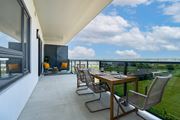 Windsor apartment for rent - A patio with a table and chairs overlooking a grassy field at Damask, Windsor, N8S 0B7
