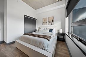 Windsor apartment for rent - A bedroom with a large bed and a window at Damask, Ontario