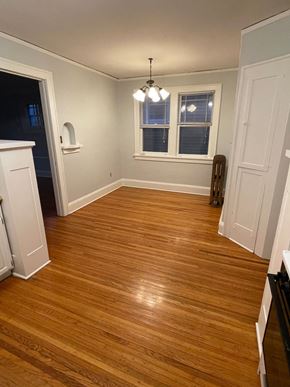 St. Paul apartment for rent - A room with wooden floors and a window.