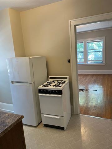 St. Paul apartment for rent - A white refrigerator and stove in a kitchen.
