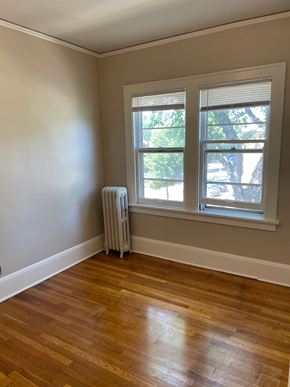 St. Paul apartment for rent - A room with a window and a radiator on the wall.