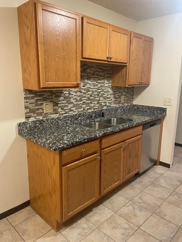 Fridley apartment for rent - A kitchen with wooden cabinets and a granite countertop.
