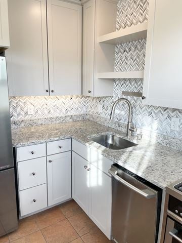 St. Paul apartment for rent - A kitchen with white cabinets and a granite countertop.