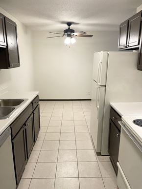 Fridley apartment for rent - kitchen opens to dining area and living room