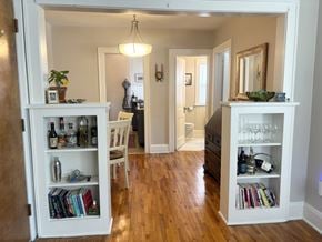 Saint Paul apartment for rent - Formal dining room with built-in hutches separating the space from the living room.  Hardwood floors throughout.