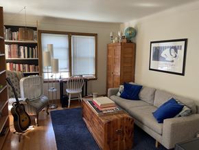 St. Paul apartment for rent - Comfortable living room with original hardwood floors and coved ceilings.