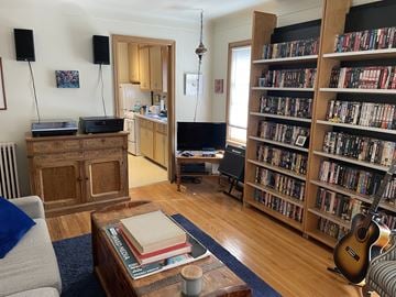 St. Paul apartment for rent - A living room with a bookshelf filled with books.