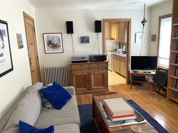 St. Paul apartment for rent - A living room with a grey couch and a wooden coffee table.