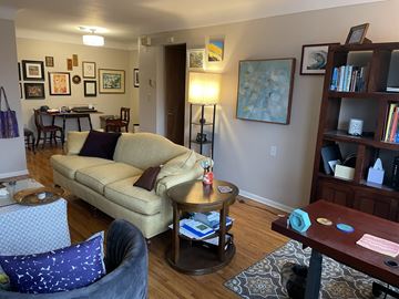 Saint Paul apartment for rent - A living room with a tan couch and a grey chair.