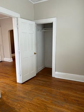 St. Paul apartment for rent - A white door is open to a room with wood flooring.