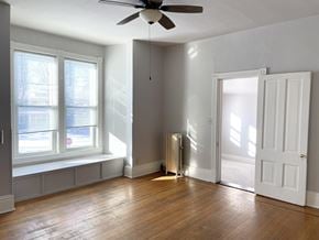 St. Paul apartment for rent - Huge sun-washed living room with high ceilings and a southwest-facing bay window.