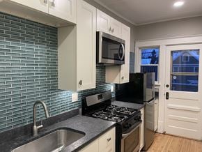 St. Paul apartment for rent - Unit 4 kitchen - updated with designer finishes and modern appliances.  Private deck off the kitchen.