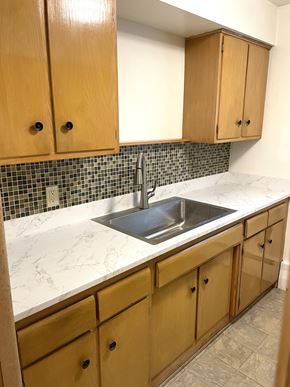 Saint Paul apartment for rent - Upgraded kitchen with new countertops, sink, faucet, and attractive mosaic tiled backsplash.