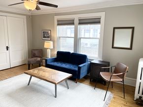 St. Paul apartment for rent - Spacious living room, coved ceilings and hardwood floors.