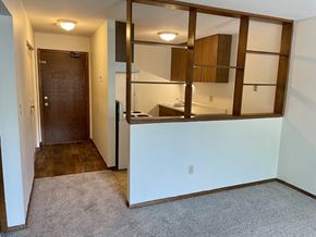 St. Paul apartment for rent - A room with a brown door and a white wall.