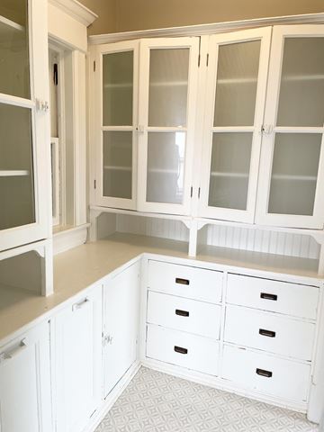 St. Paul apartment for rent - A kitchen with white cabinets and drawers.