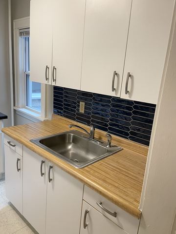 Saint Paul apartment for rent - A kitchen with a sink and cabinets.
