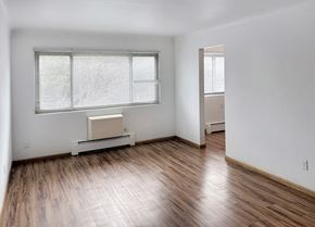 St. Paul apartment for rent - A room with a window and a radiator on the floor.